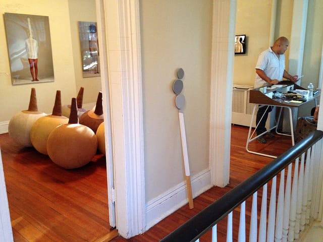 A view of the 2013 Governors Island Art Fair that includes sculptures (left) by Raquel Paiewonsky