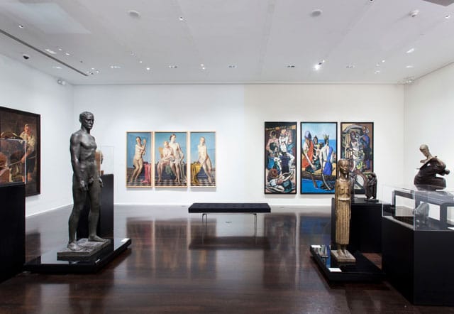 Installation view, 'Degenerate Art: The Attack on Modern Art in Nazi Germany, 1937' at Neue Galerie, with Adolph Ziegler's “The Four Elements” on wall at left Max Beckmann's “Departure” on wall at right