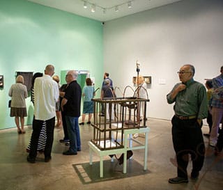 Opening night of The Paternal Suit: In the foreground the Liberty County Learnin ’ʼmachine,” (photo by Cara Garcia)