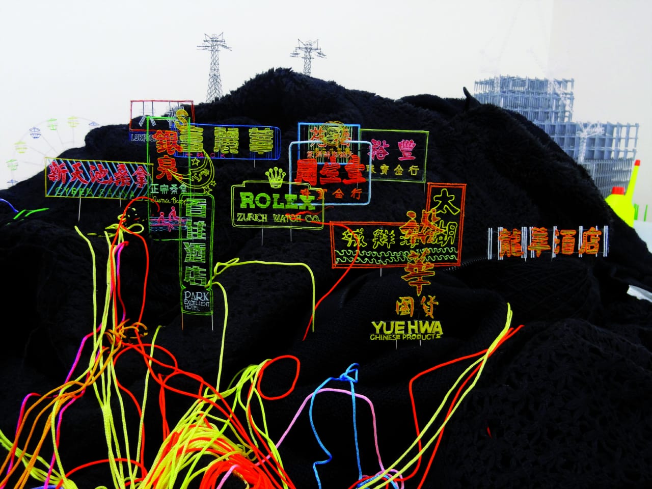 Takahiro Iwasaki, Out of Disorder (Neonscape), 2013. Clothes, Lily yarn. Dimensions variable. Image credit: Courtesy of the artist and Arataniurano, Tokyo