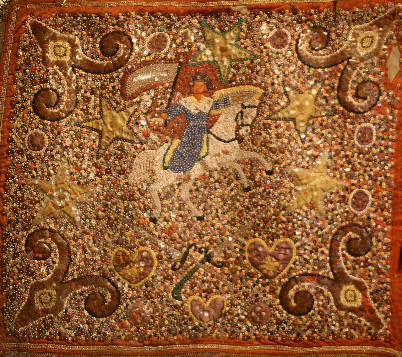 Ogou Sen Jak, mid 20th century, satin, sequins, beads, trapunto applique’, cotton, and fringe, 28 1/2 x 26 x 3/8 inches, private collection