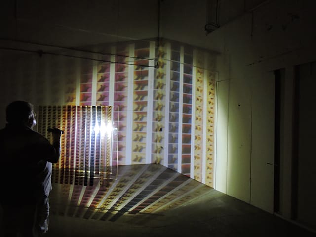 Jennifer West, 'Flashlight Filmstrip Projections' (2014) (photo by the author for Hyperallergic)
