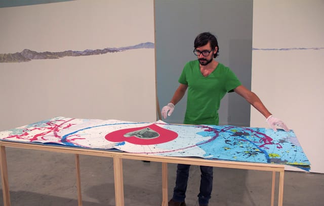 Christopher Kardambikis with his artist's book "Mundus Subterraneus"