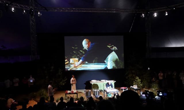 Chef Tatsuru Rai rolls out soba dough in silence while his wife, Midori and the entire tent watches