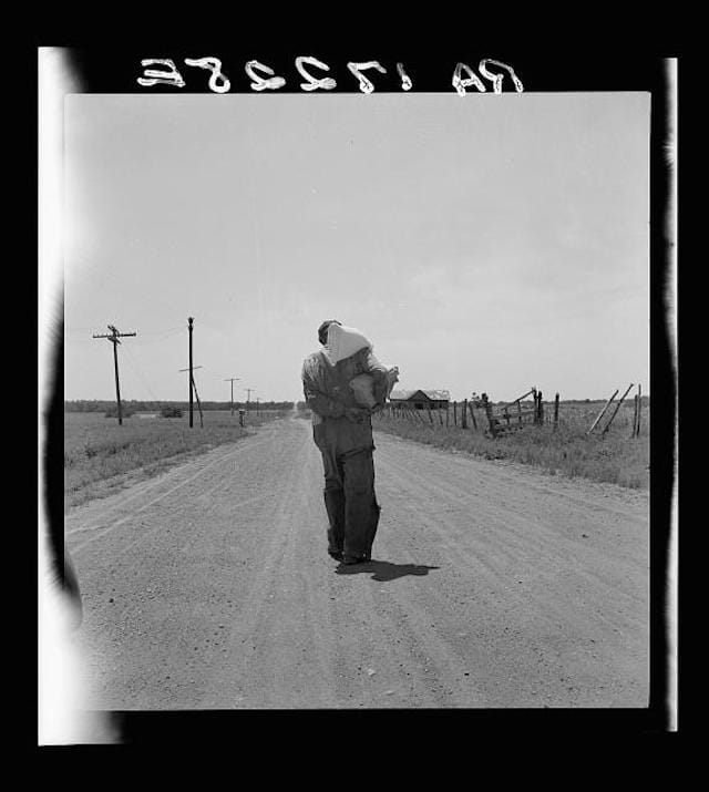 Man walking home with relief provisions near Oil City, Oklahoma, photograph by Dorothea Lange (June 1937) (via Photogrammar/Libray of Congress)