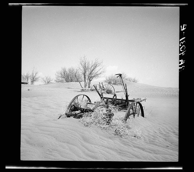 Farm machinery buried in drifting soil, Cimarron County, Oklahoma, photograph by Arthur Rothstein (April 1936) (via Photogrammar/Library of Congress)
