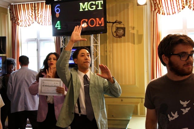 Trade Practices. Pictured L-R: Jenniffer Diaz (purple jacket), Dax Valdes (green jacket). Photo credit: Carl Skutsch.