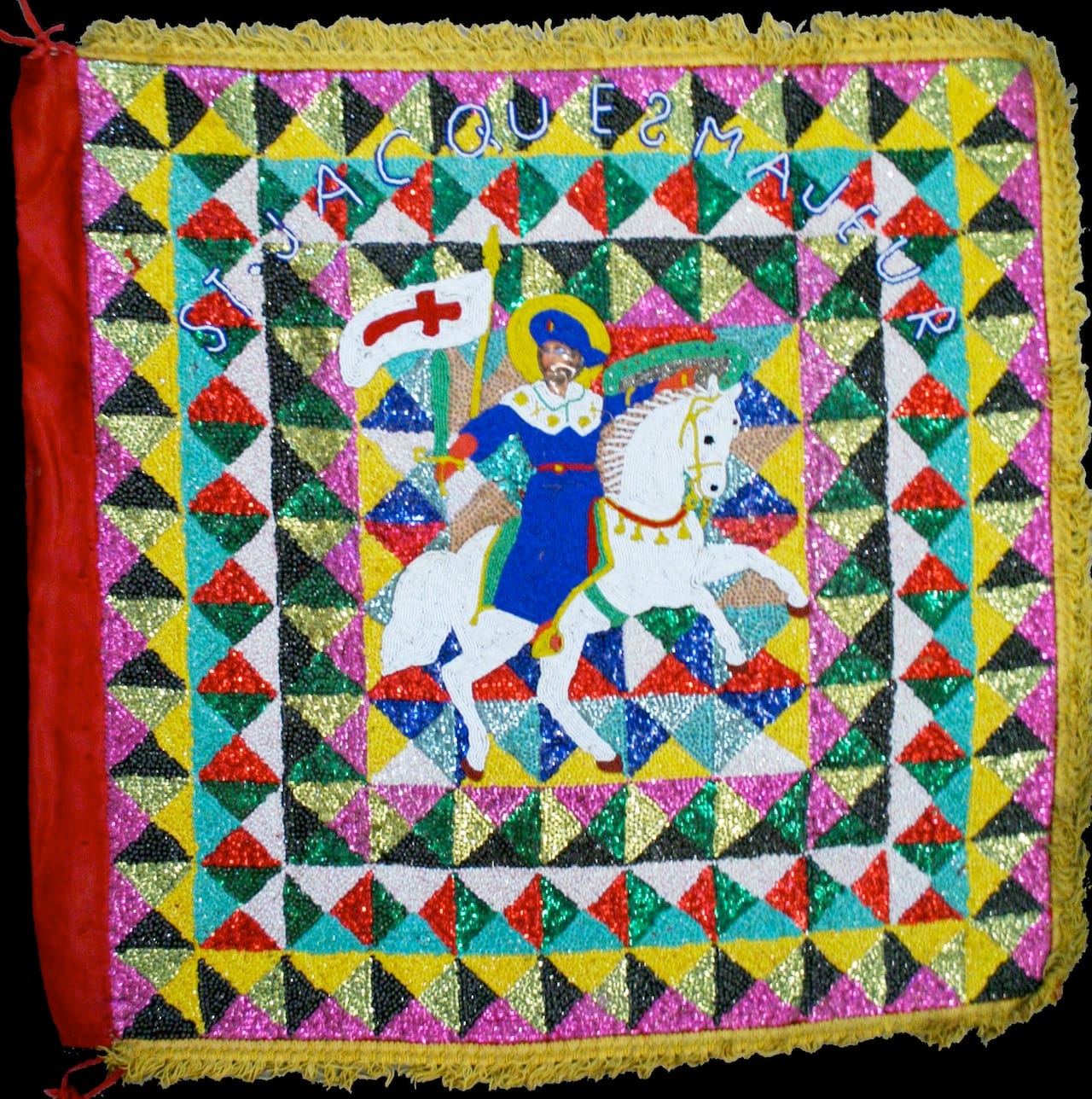 Ogoun (Rada) d Mid 20th century Plastic, satin, sequins, beads, burlap, thread, cotton, and fringe 34 x 33 1/2 x 1/2 Courtesy Thomas Schultz Collection