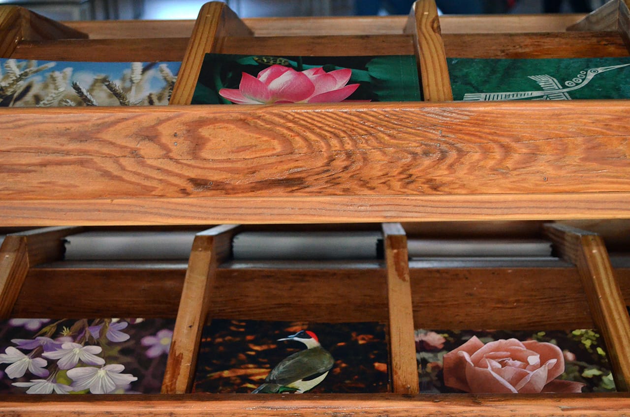 Some of the postcards from "Yours Truly" (2014) that invite visitors to write a message to a prisoner around the world.