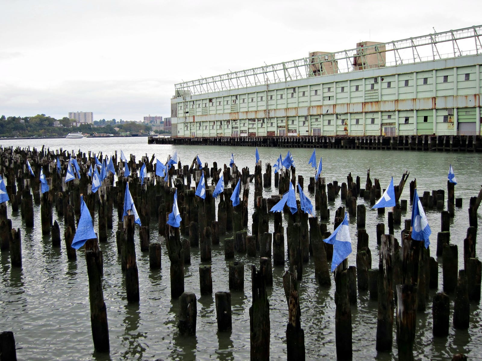 Johannes Rantapuska and Milja Havas, "Flux Flags," installed on the old pilings in the Hudson between Pier 54 and 57 at the end of 14th Street