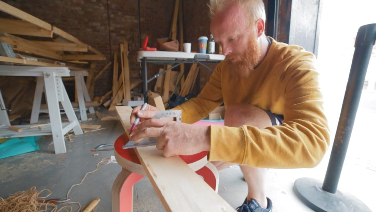 James Bowthorpe building his boat in Red Hook (photo by  Alex Colby)