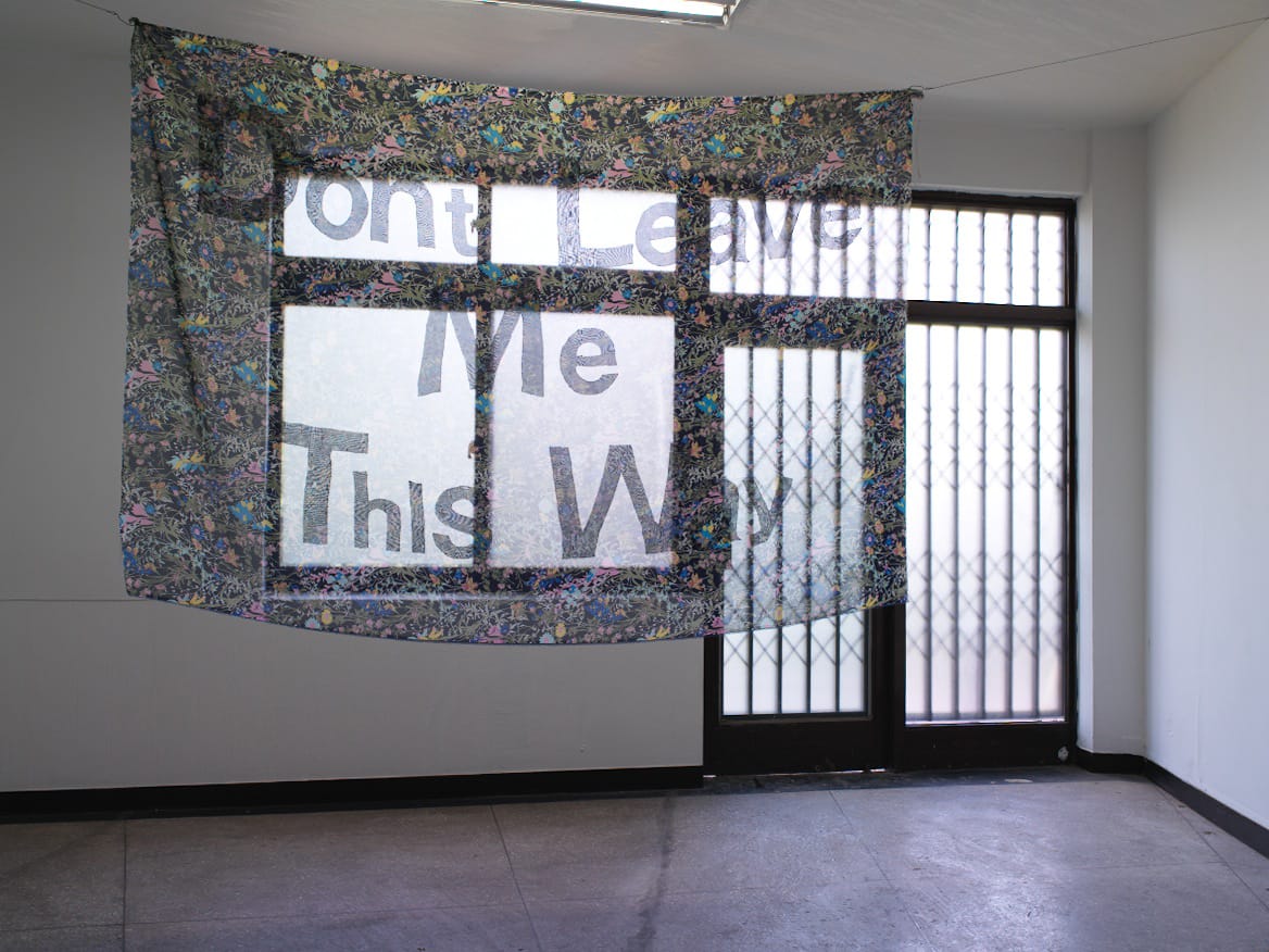 The text on Yeonjune Jung’s appliqued textile work “Don’t Leave Me This Way” (2014) is only visible when seen against light.
