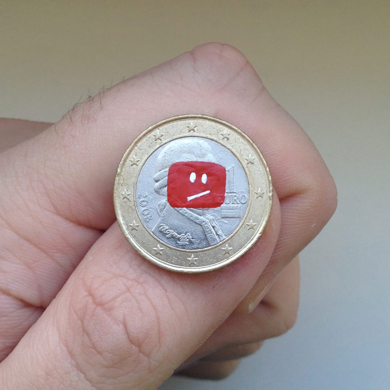 Andre Levy coin painting of the YouTube error icon