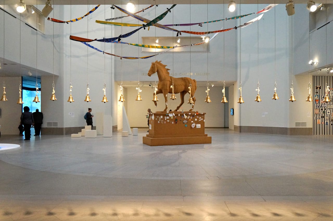 Installation view, 'Crossing Brooklyn' at the Brooklyn Museum, with  Paul Ramirez Jonas's "The Commons" (2011) in the center of the room (all photos by the author for Hyperallergic)