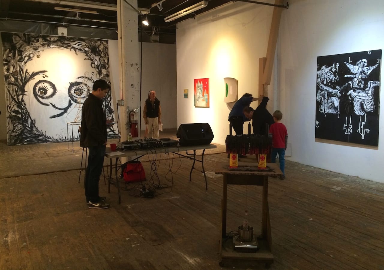 Installation view of a pop-up show at 610 Smith Street, including a large tapestry by Shura Skaya at far left (all photos by the author for Hyperallergic)