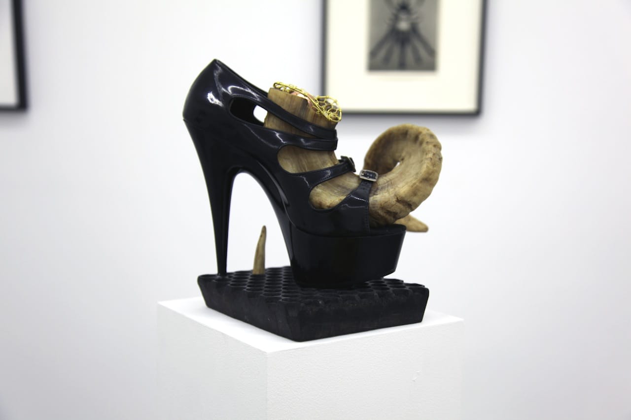 BREYER P-ORRIDGE, "Shoe Horn #3" (2014),  ram horn, shoe worn by Genesis as "Lady Sarah" (he/r dominatrix persona), sting ray skin, ermine fur, bone, Nepalese fabric-printing square, brass netting, copper ball, 9.25 x 9 x 8 in (courtesy the artists and Invisible-Exports)