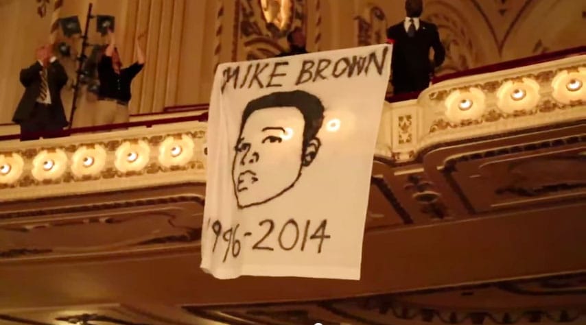 Screenshot from Rebecca Rivas's video of "Requiem for Mike Brown" protest at the St. Louis Symphony Orchestra (via YouTube)