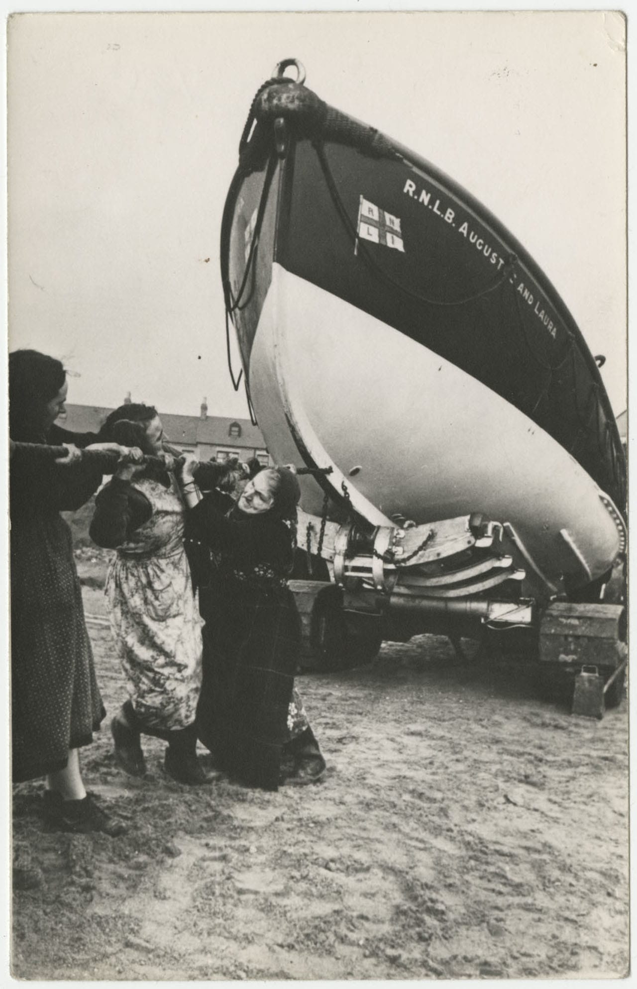 Women pulling a ship