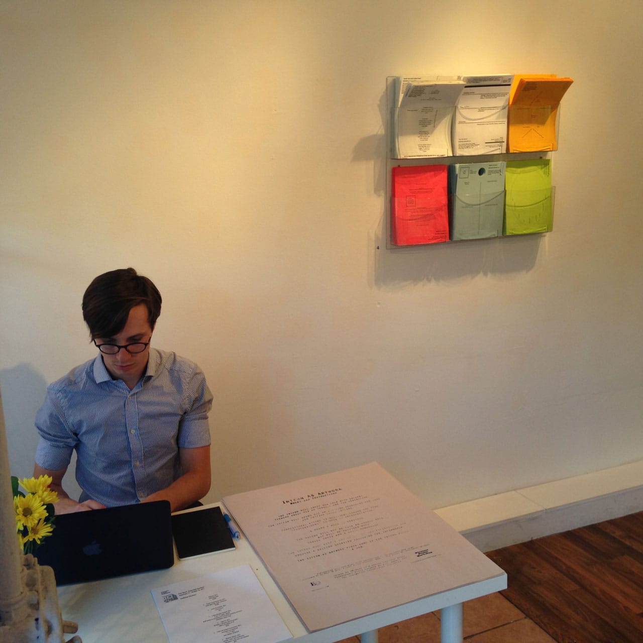 Paul Shortt's "Intern as Artwork" (2014) features intern Michael Schiffer searching for jobs as a performance in the gallery. (click to enlarge)