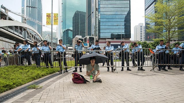 A protester in Hong Kong (Image via Wikimedia) 
