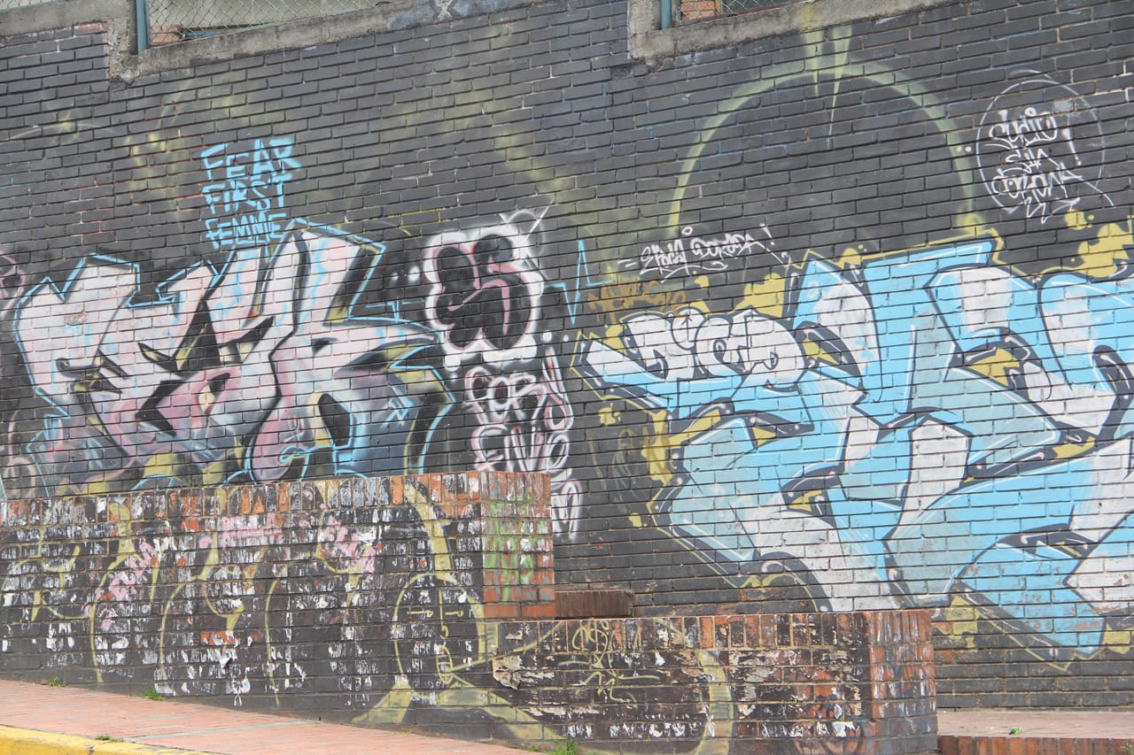 Detail from a wall featuring work by Fear and Zas (all photos by the author for Hyperallergic)