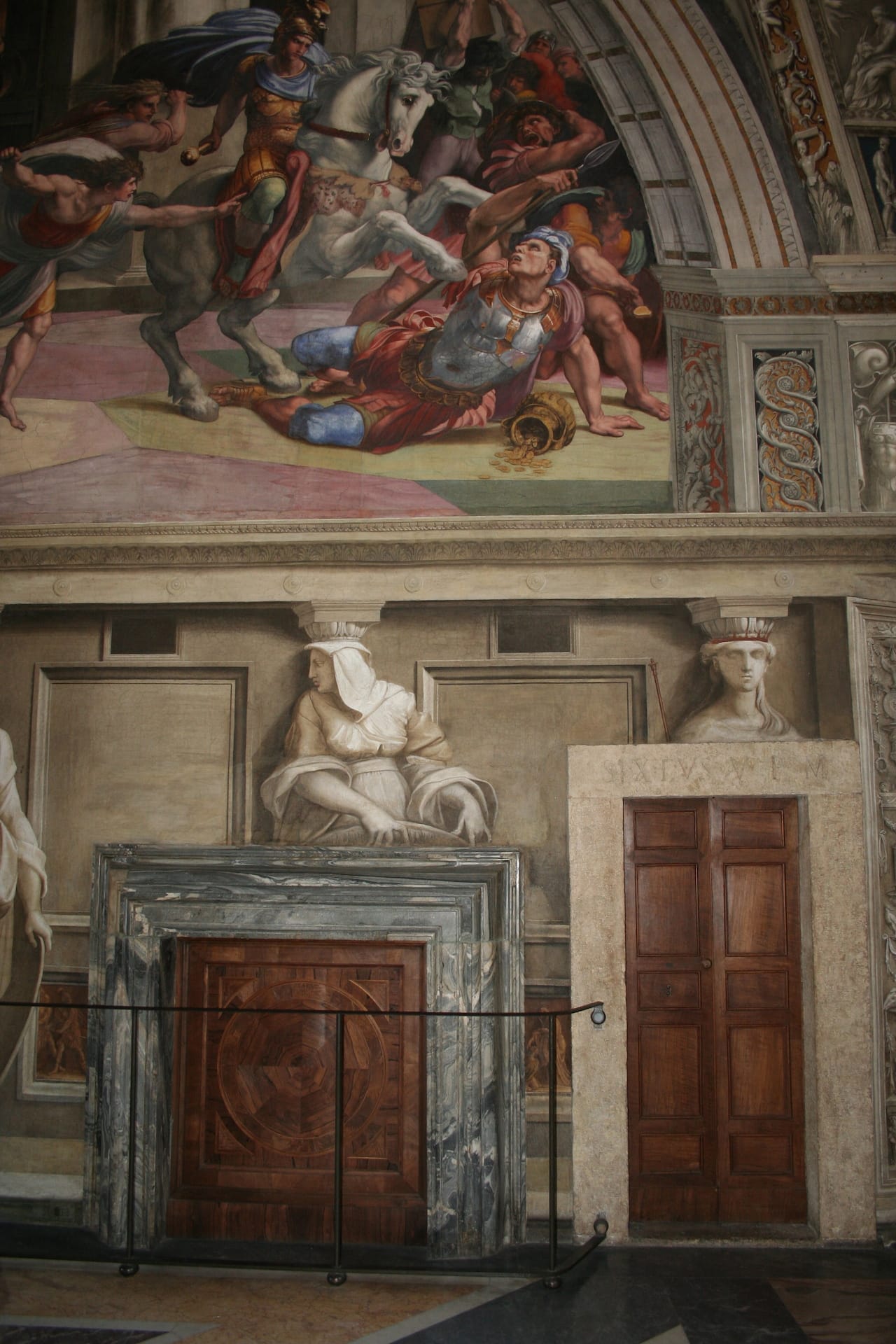 Rome, Vatican Palace, Heliodorus room, view of the marble chimney located under Raphael's fresco, "Expulsion of Heliodorus from the Temple" (1511–12) (photo © Charlotte Guichard, reproduced with the permission of the Vatican Museums)