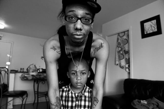 A son gives his father a cold shoulder. 