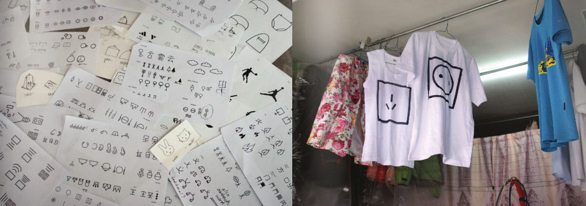 Left, Printouts of new symbols for "In a Simplified Word," and, right, 'East' vs. 'West' hanging on a laundry line.