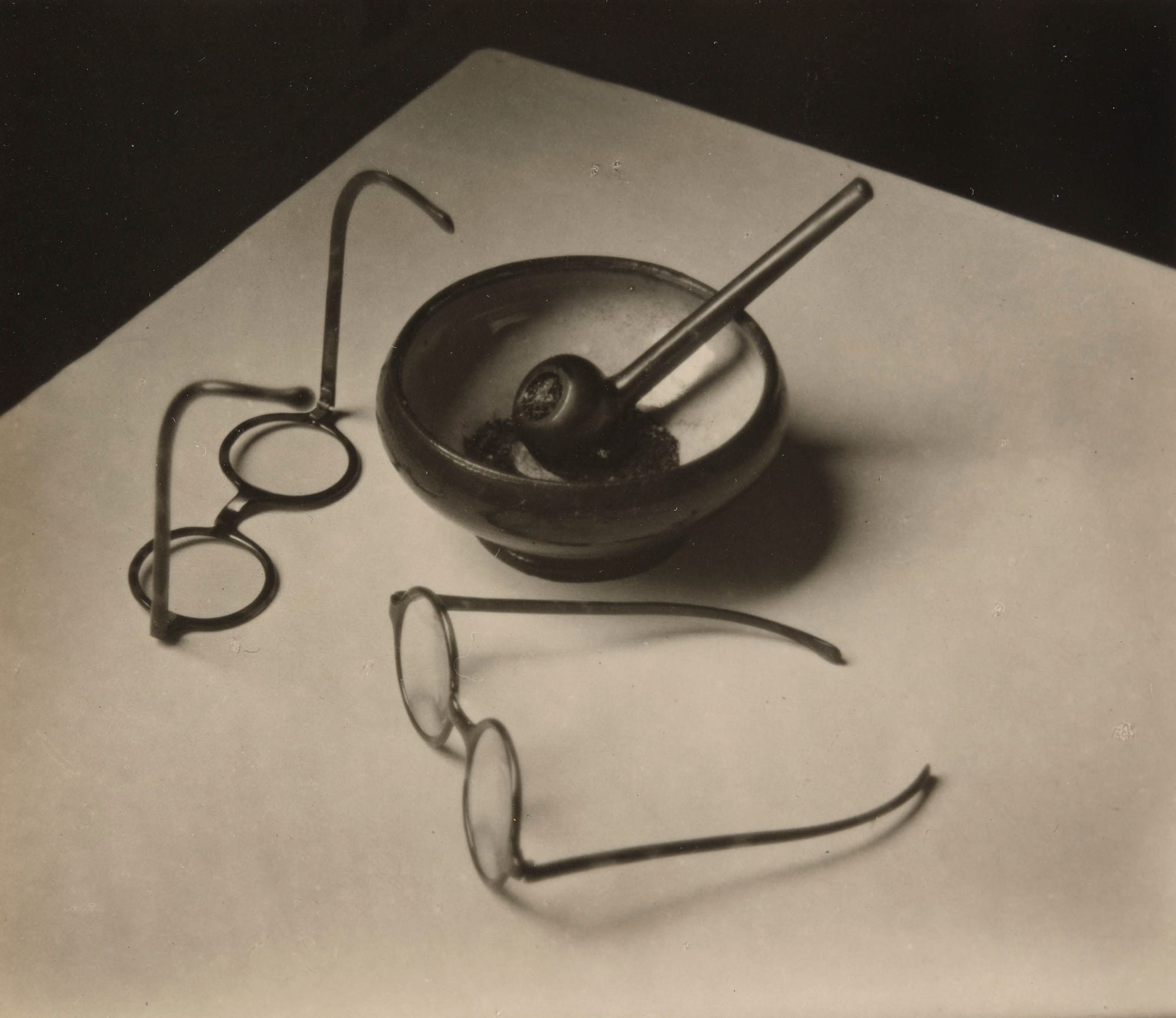 André Kertész (American, born Hungary. 1894–1985). Mondrian’s Glasses and Pipe. 1926. Gelatin silver print. 3 1/8 x 3 11/16″ (7.9 x 9.3 cm). The Museum of Modern Art, New York, Thomas Walther Collection. Grace M. Mayer Fund © 2014 Estate of André Kertész