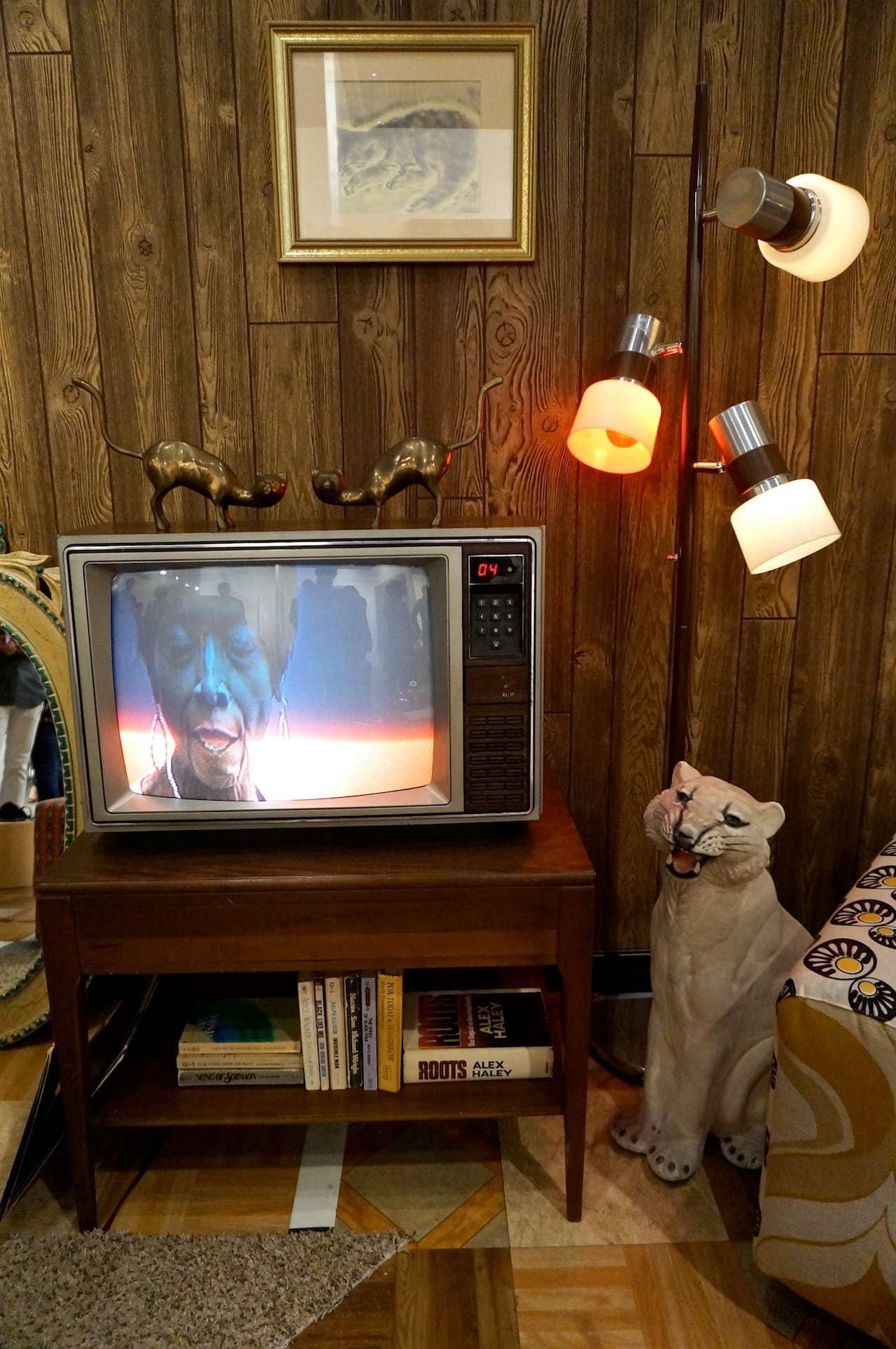 Detail of Mickalene Thomas installation, with the artist's film about her mother playing on the TV