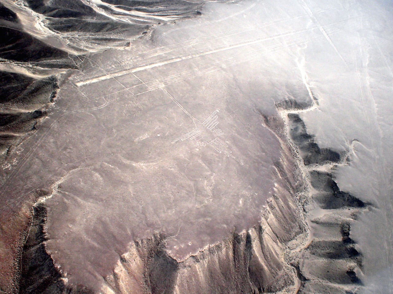 Aerial view of the "Hummingbird" formation at the Nazca lines site in southern Peru (photo by Martin St-Amant via Wikimedia Commons)