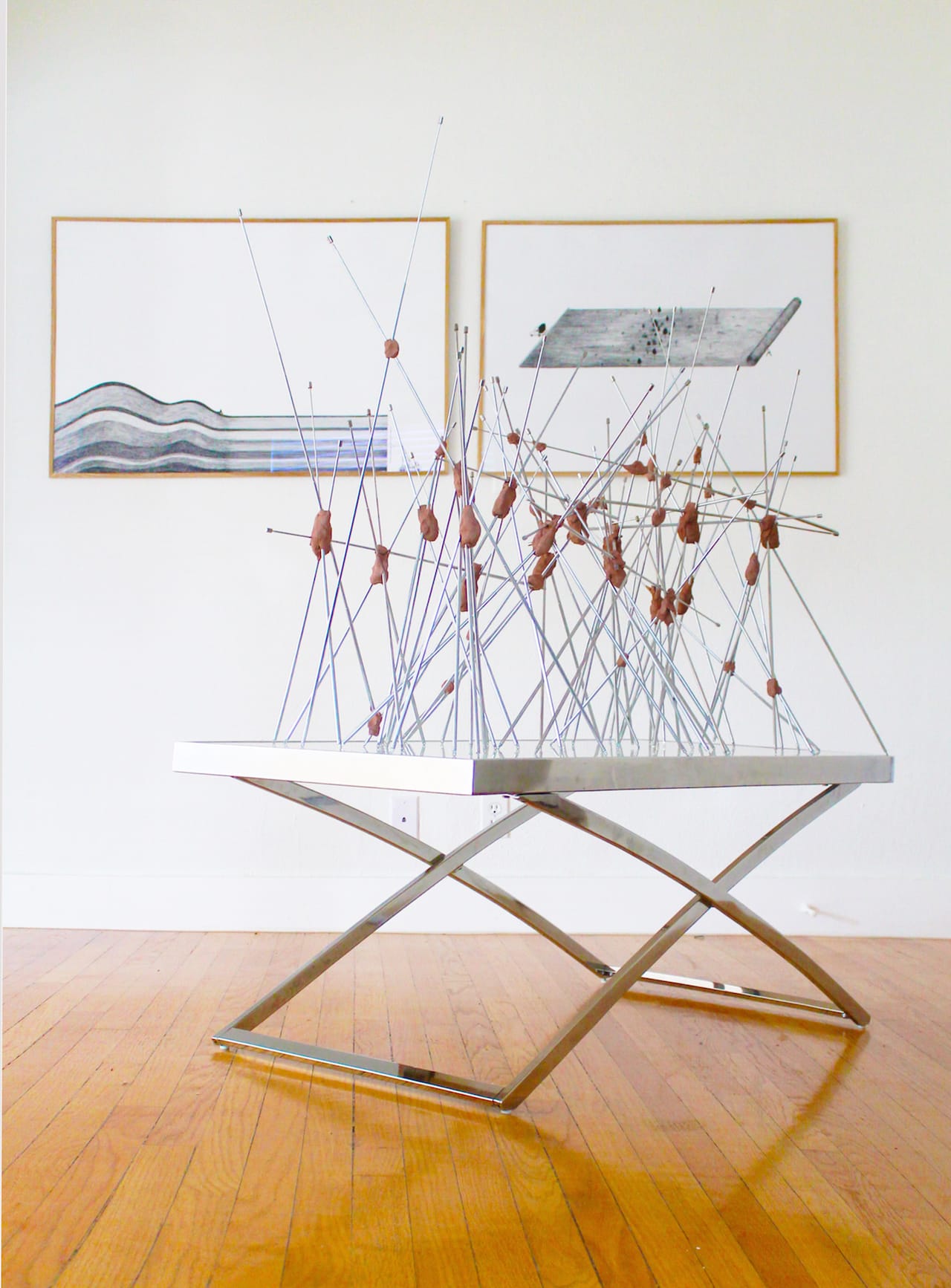 Pierre Clément, "High pass filter" (2014), stainless steel antennas, modeling clay, table (works by Vincent Broquaire in the background)