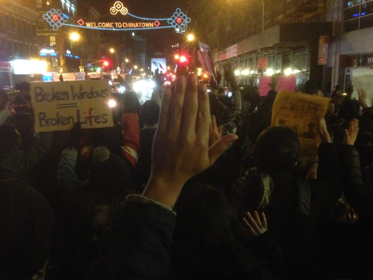"Hand's up, don't shoot" gesture on Canal Street. Photos by the author for Hyperallergic except where noted.