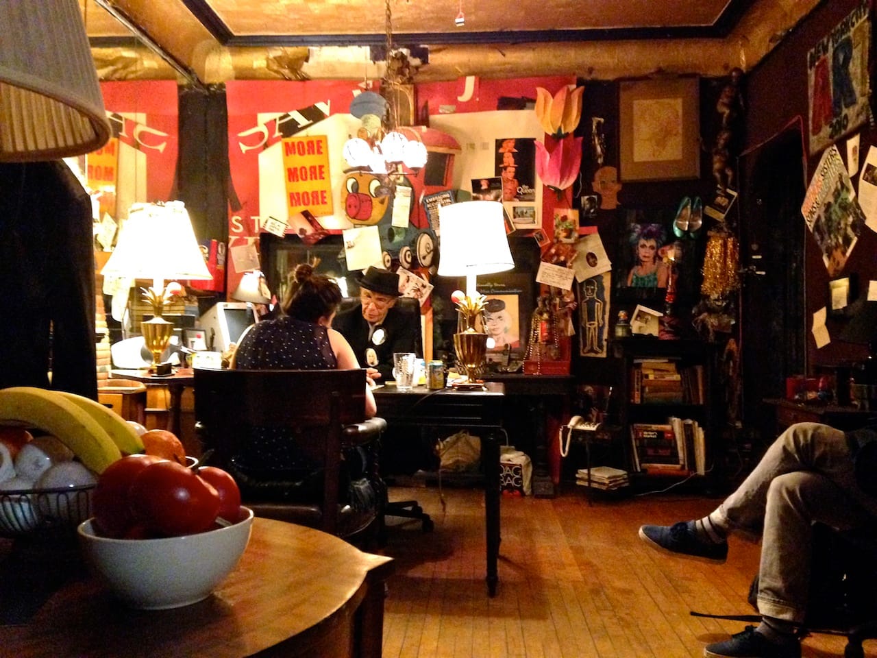 Flawless Sabrina reading Tarot cards in her apartment (photo by the author for Hyperallergic)