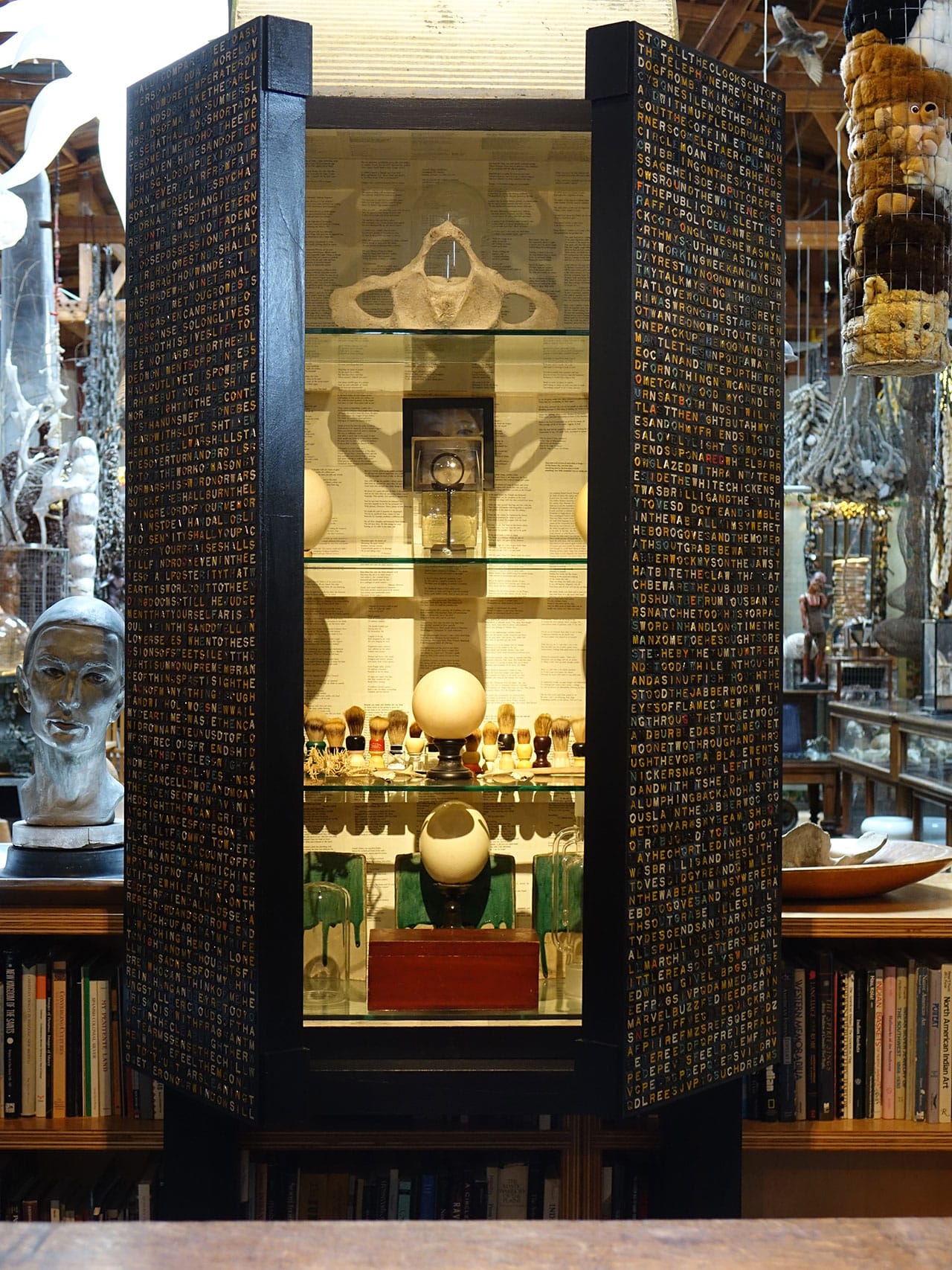 Clare Graham, Anagram Tiled Cabinet w/ personal collection (2014) (photo by Kim Kralj, courtesy CAFAM) (click to enlarge)