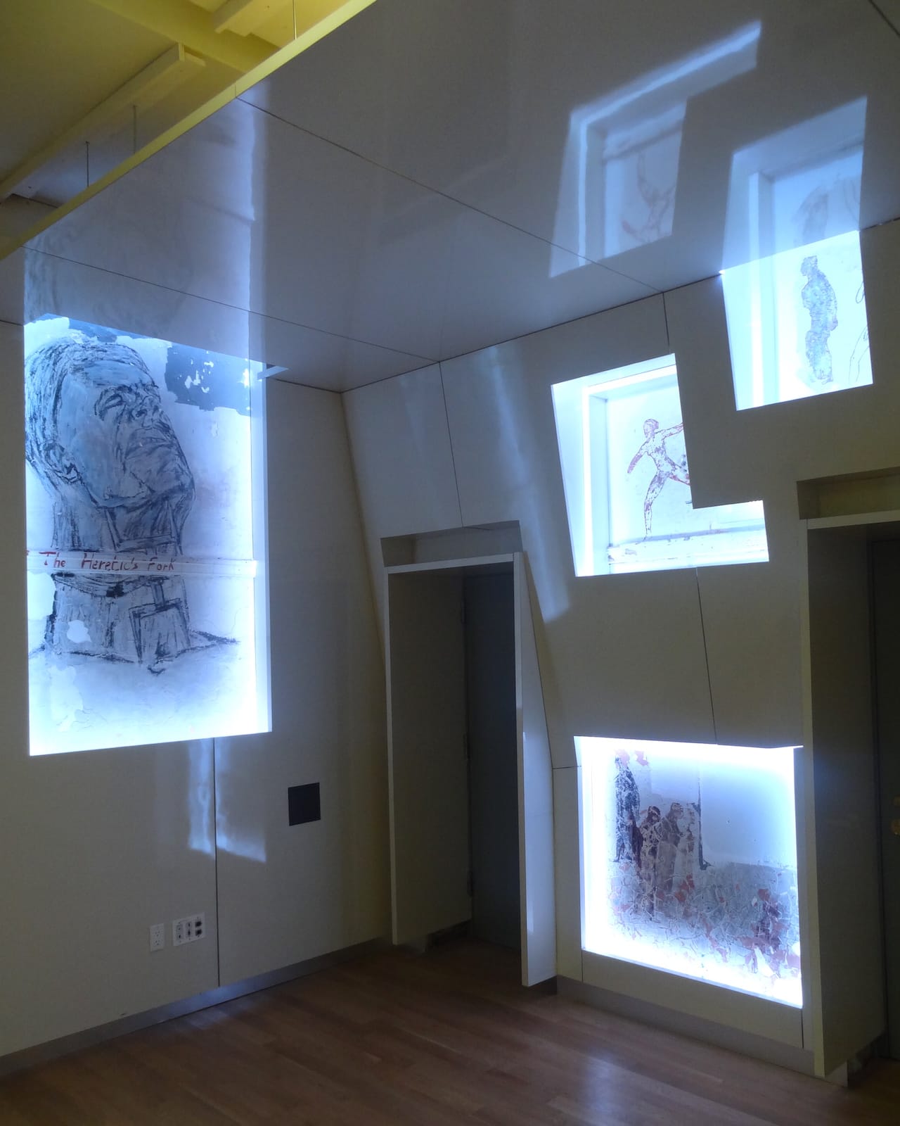 Works by Leon Golub and Nancy Spero in the LGBT Center's Kaplan Assembly Hall