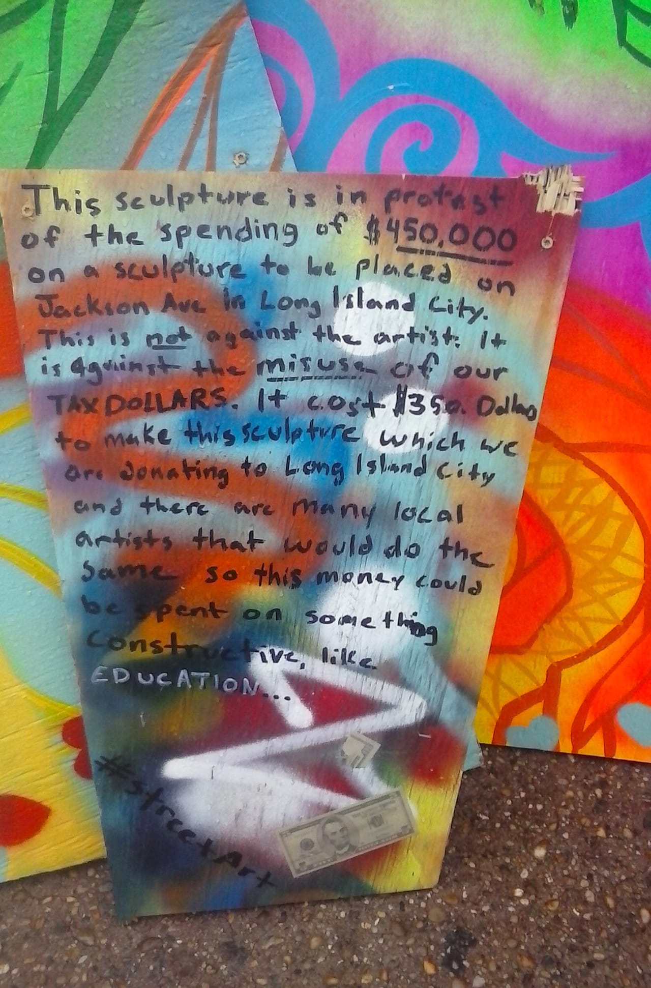 Detail of artwork on Jackson Avenue protesting Ohad Meromi's "Sunbather"