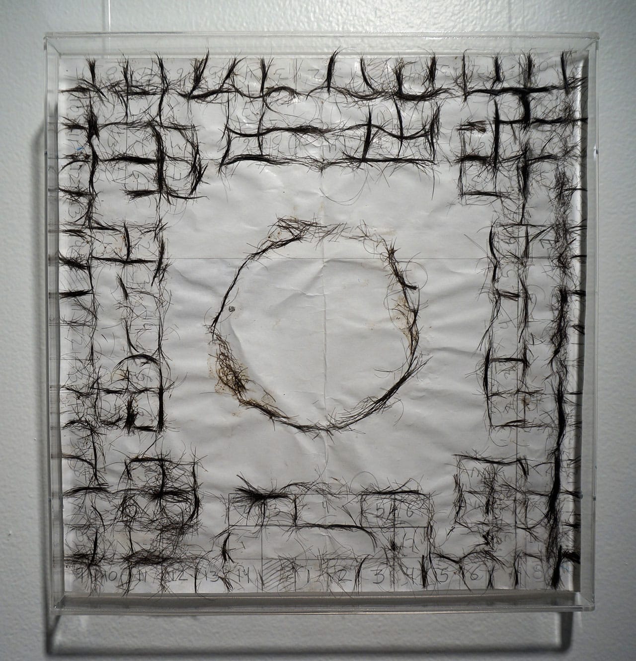 José Antonio Vega Macotela, "Time Divisa. Intercambio 331" (2010), human hair and paper. "In exchange for the artist spying on his ex-lover in the Zona Rosa, 'Eduardo' made a poleana board (a board game that is also a visual representation of the prison) using a combination of both his and his current lovers' hair." (click to enlarge)