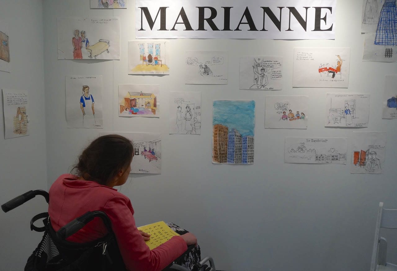 Marianne Schipaanboord with her artwork at the Een Nieuwe Wind booth