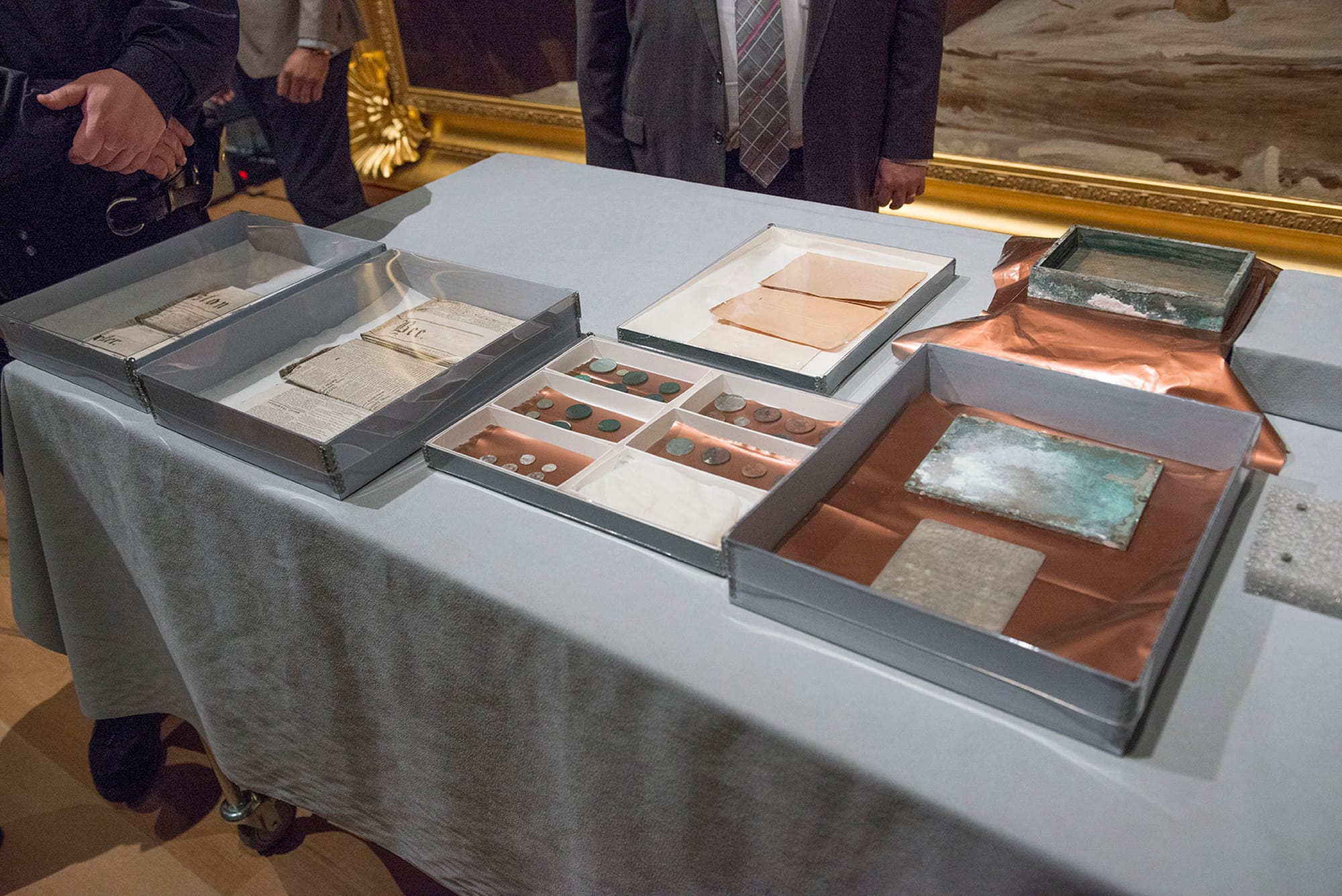 Contents of a time capsule found in the cornerstone of the Massachusetts State House building and undergoing examination and conservation work at the Museum of Fine Arts, Boston. January 6, 2015 (Photo courtesy of Museum of Fine Arts, Boston)