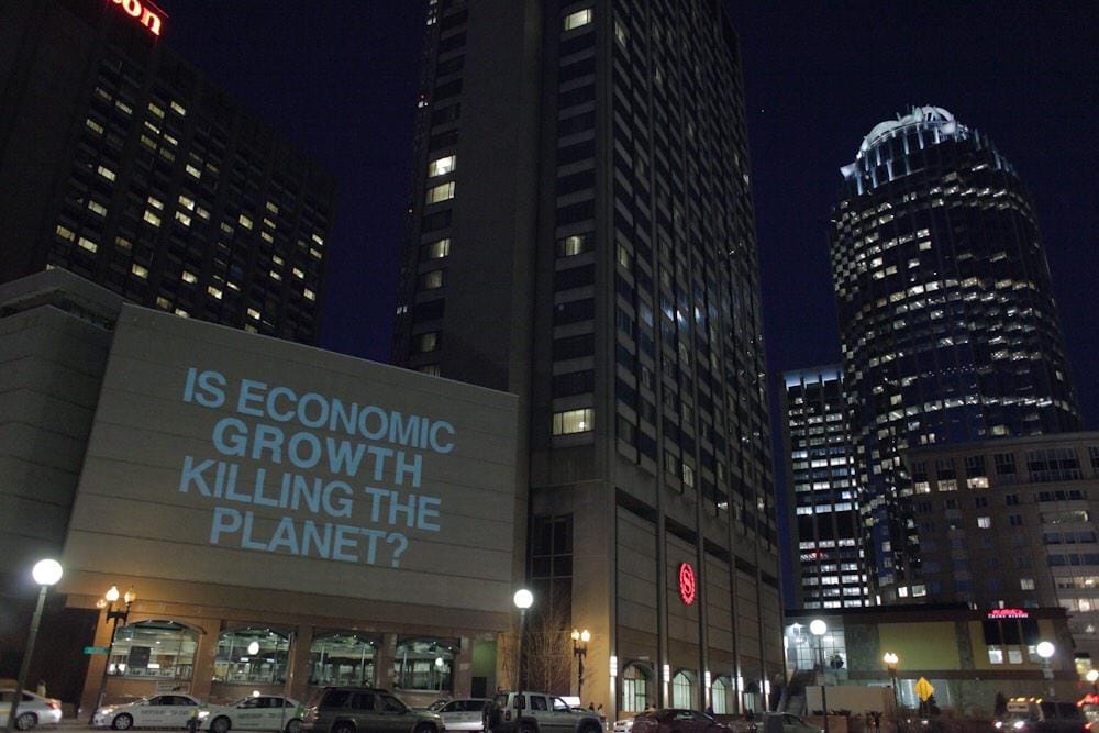 The Illuminator's message during a recent action in Boston (photo via illuminator99/Twitter)