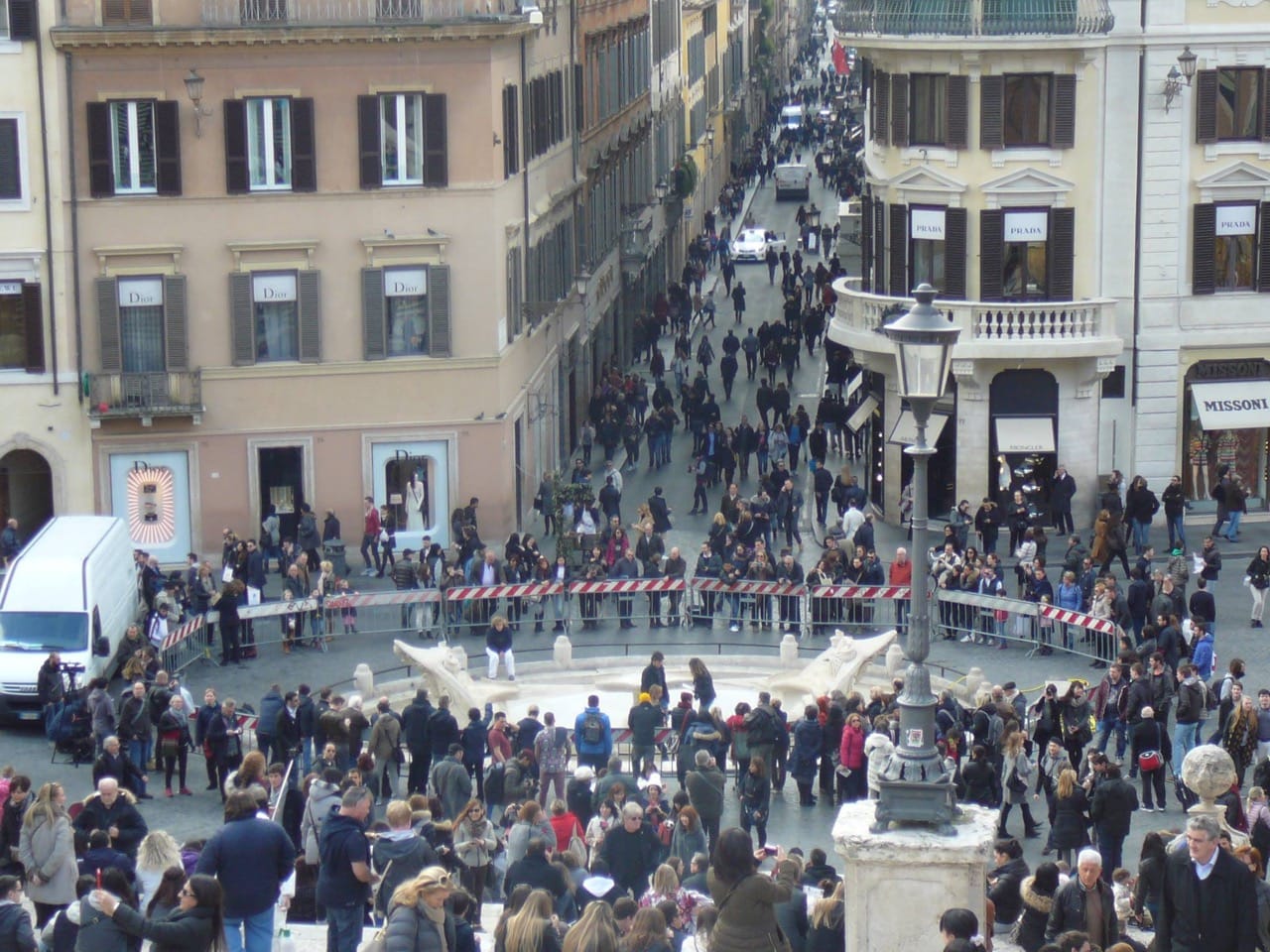 People gathered around the Fontana della Barcaccia in the piazza di Spagna in Rome today