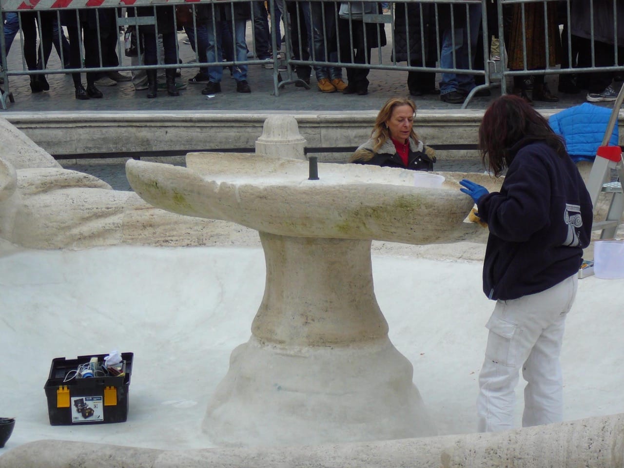 Restorers working on the Barcaccia fountain in the wake of last week's damage (photo by Valerio Mezzolani)