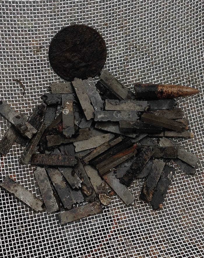 Detail of the the Doves Press type sifted from the Thames, with a stray bullet (via Typespec)