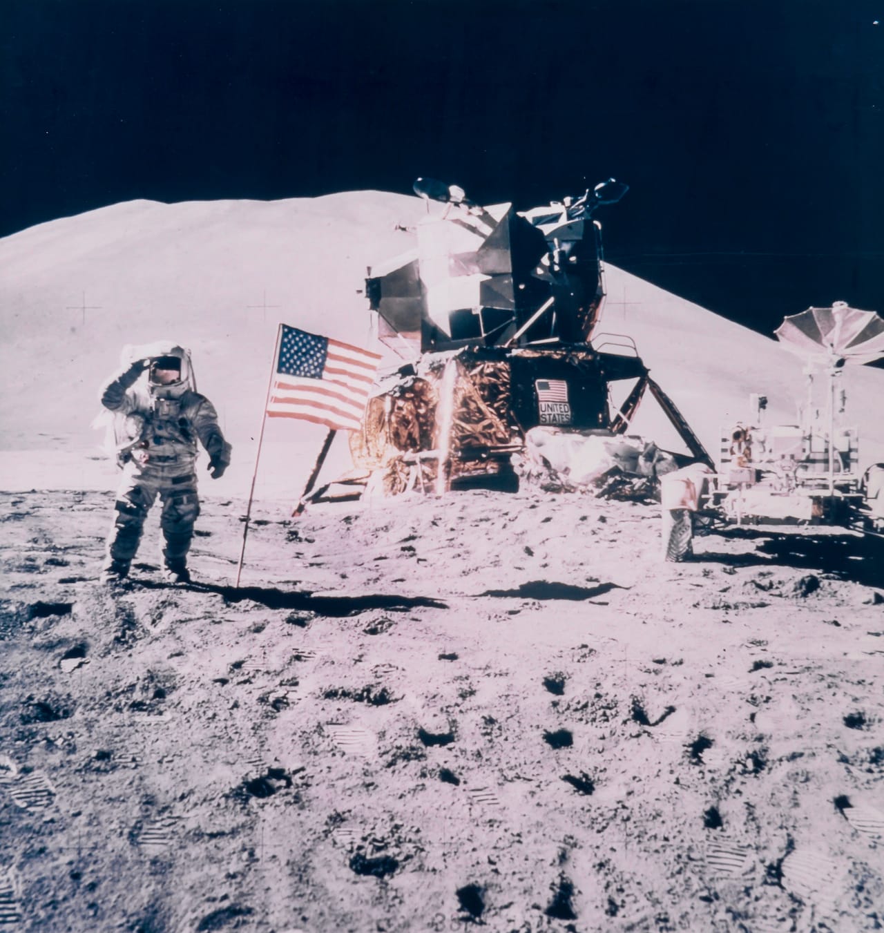 David Scott James Irwin salutes the American flag, Apollo 15, August 1971 Large-format vintage chromogenic print on fibre-based Kodak paper, 51 x 41cm, 42 x 40cm, RCA  stamp and “A Kodak Paper” watermark on verso, [NASA negative number AS15-88-11866] Few Apollo photographs have been reproduced more often than this photograph of Irwin, the flag,  the Rover, the LM and Mount Hadley. Illustrated: A man on the Moon pp 64-65 Est. £4,000-6,000 Reproduction, © Bloomsbury Auctions