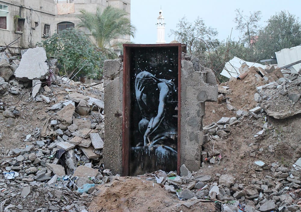 Another Banksy work of a mourner.
