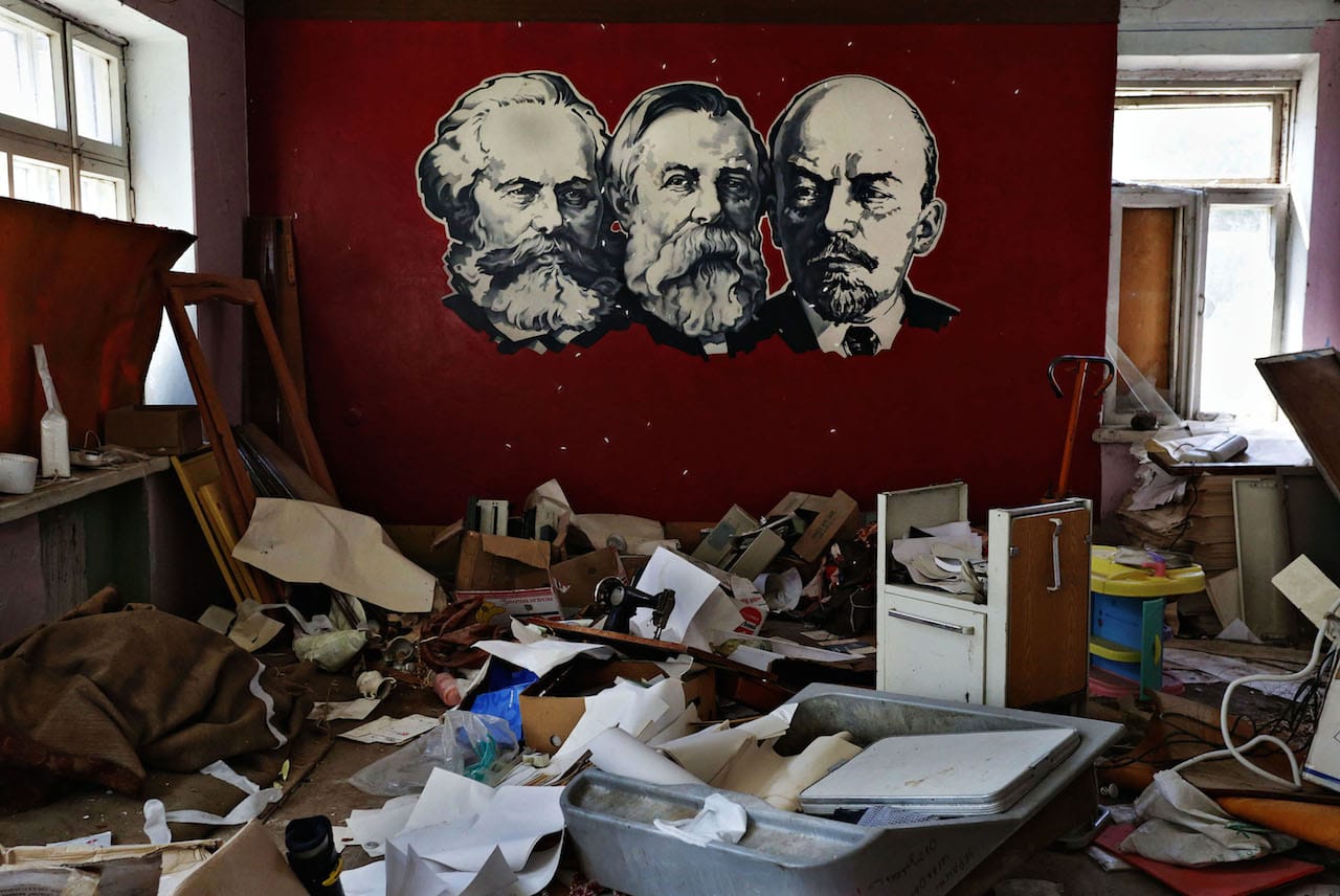 The portraits of Karl Marx, Friedrich Engels and Vladimir Lenin are seen at the wall of a destroyed with shells rehabilitation center for alcohol and drug addicts in Sloviansk, Ukraine. © Anastasia Vlasova.