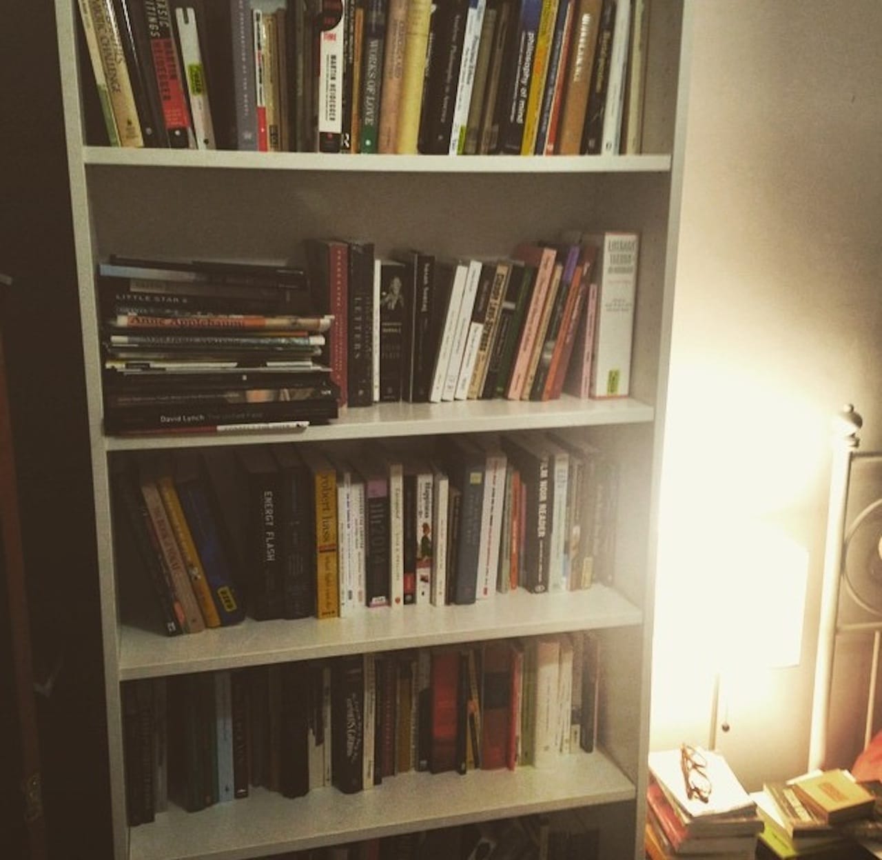 The author's bookshelf (photo by the author for Hyperallergic)