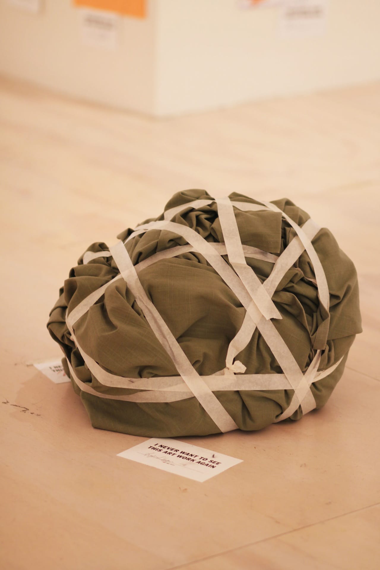 A crumpled-up blanket wrapped in tape.