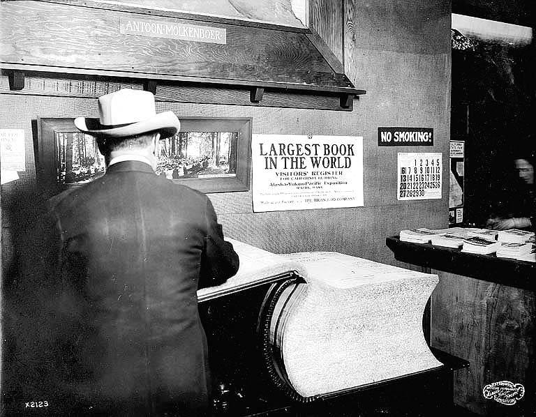 The "largest book in the world," a visitor's register in the California Building at the 1909 Alaska Yuko Pacific Exposition, photographed by Frank H. Nowell (University of Washington Libraries, via Wikimedia)